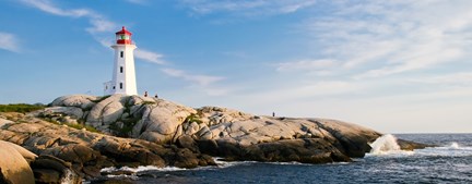 Lighthouse, rocks, and tide pool in Nova Scotia, Canada