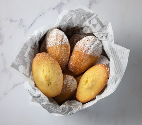 Recipe Expert French Madeleins Powdered Sugar Served Bowl Newspaper Wrapped