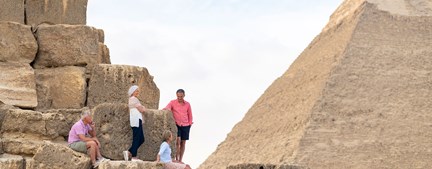 Egypt Pyramids Tourists Sitting On Steps