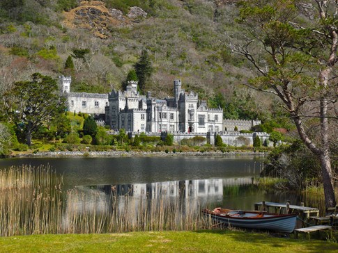 Kylemore Abbey with boat in foreground, Connemara, Ireland