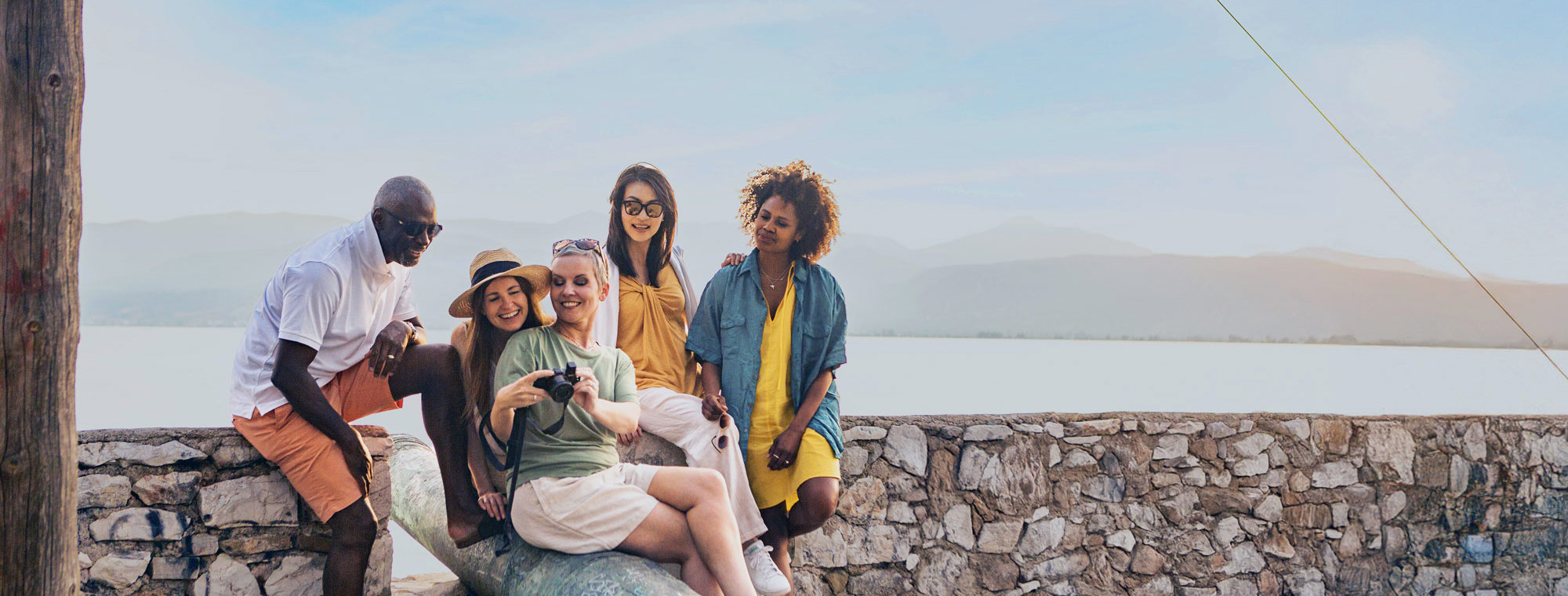 Guests Enjoying Sunset In Napflion Greece Tinted