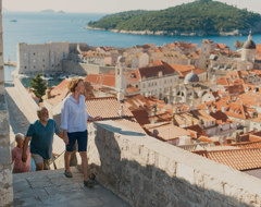 Croatia Dubrovnik Tourists Walking Up Stairs Overlooking City Tinted