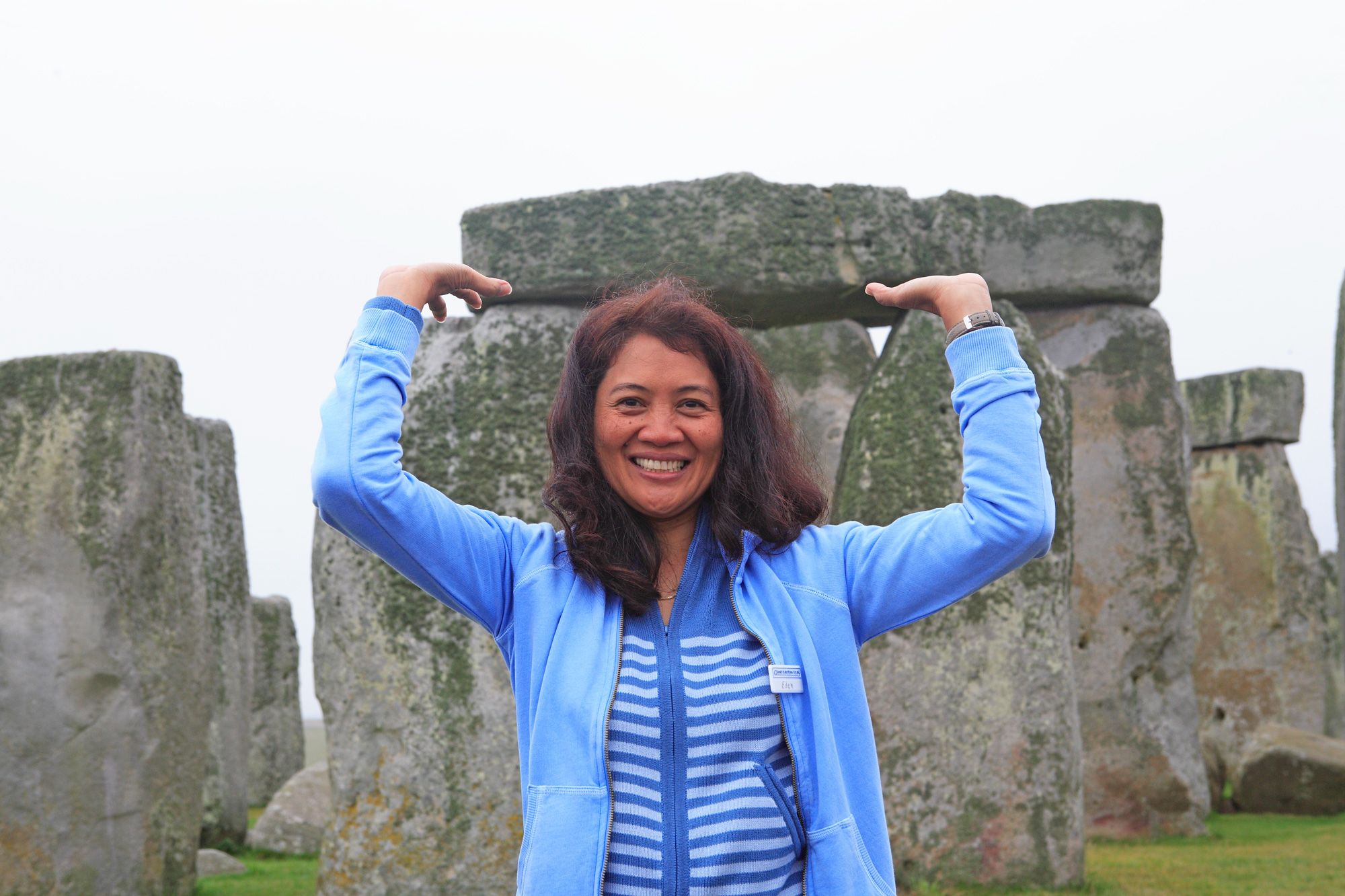 England Stonehenge Lady Holding Rock
