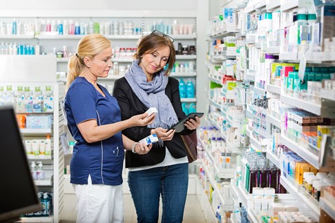 woman-comparing-in-pharmacy-with-tablet-expert-advice-seeking-medical-care-abroad.jpg