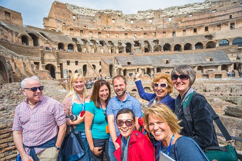 Small group of tourists at Colosseum, Rome, Italy