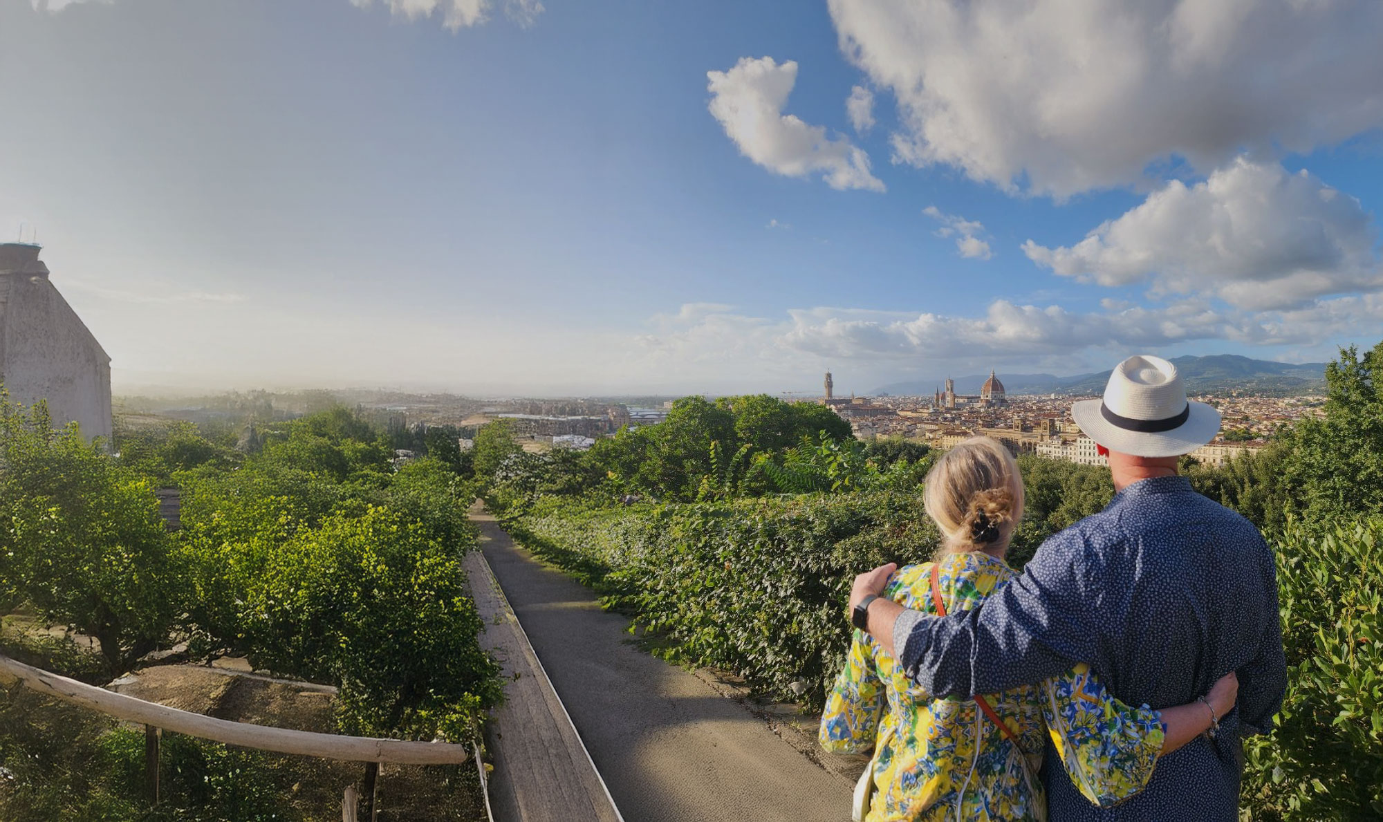 Italy Florence Cityscape Couple In Foreground White Fedora Blue Sky With Clouds Tinted