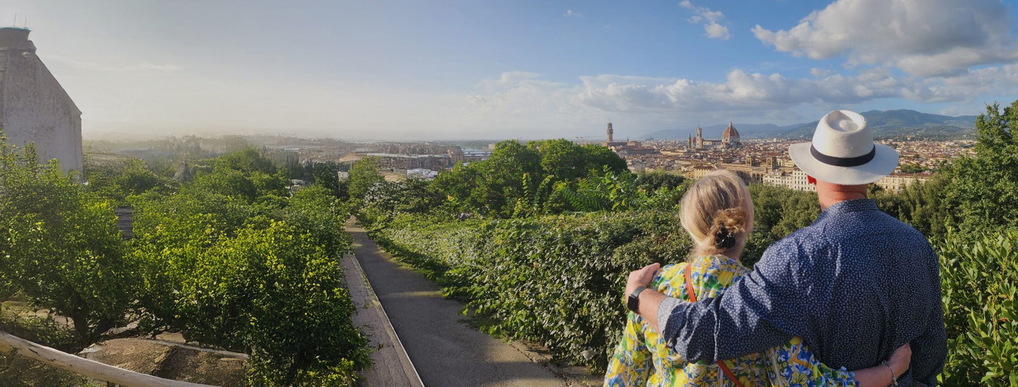 Italy Florence Cityscape Couple In Foreground White Fedora Blue Sky With Clouds Tinted