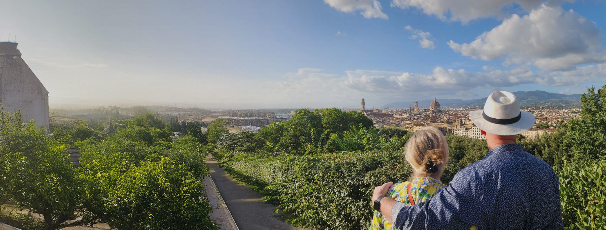 Italy Florence Cityscape Couple In Foreground White Fedora Blue Sky With Clouds Tinted