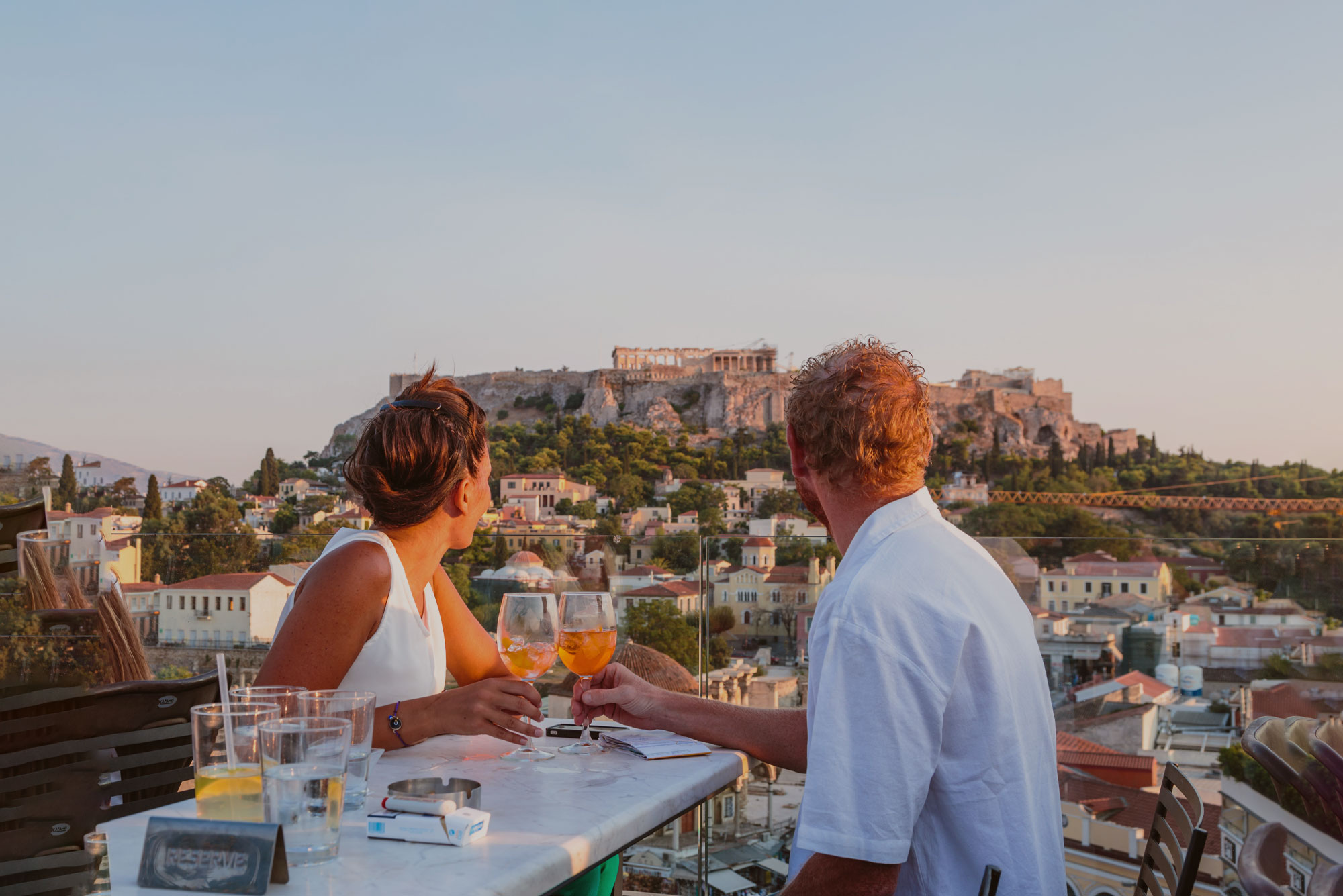 Greece Athens Couple Viewing Parthenon From Afar With Drinks Aperol Spritz