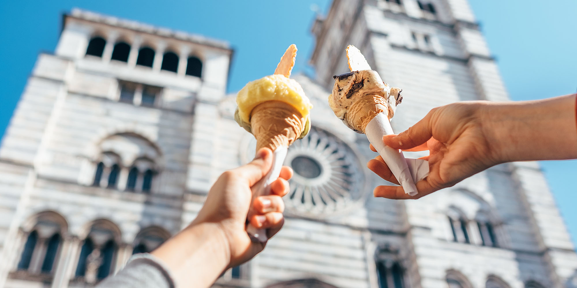 Expert Florence Italy Costsaver Partner Header Gelato Hands Blue Sky