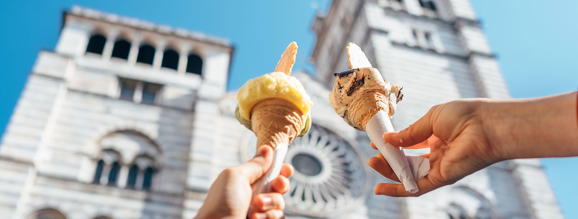 Expert Florence Italy Costsaver Partner Header Gelato Hands Blue Sky