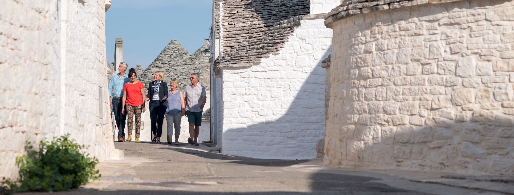 Italy Alberbello Guests Travel Director Walking Path Trulis