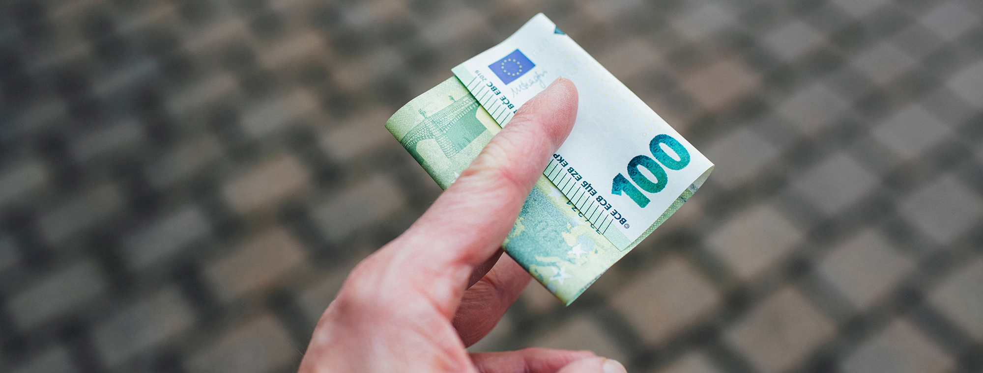 Expert Money Tip Cobblestone Street Currency Hand