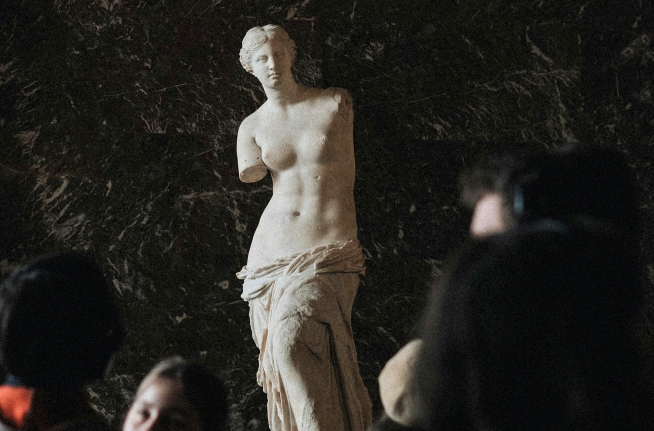 In Paris, France, at the Louvre Museum one of the top exhibits to see is the Hellenistic Greek statue of the Venus Di Milo. 