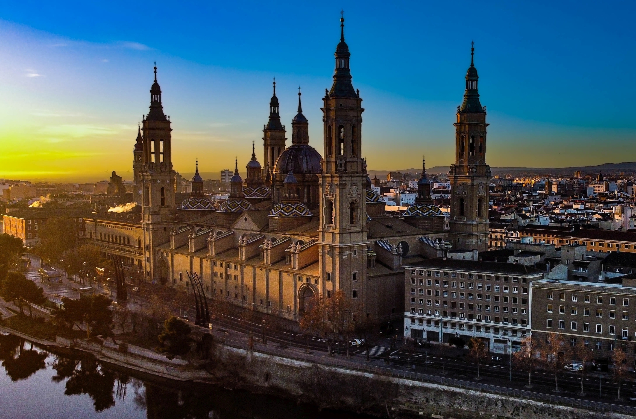 Explore Zaragoza, Spain with local specialists and experts by your side. See the famous tiled roof of the Cathedral-Basilica of Our Lady of the Pillar (Catedral-Basílica de Nuestra Señora del Pilar) overlooking the Ebro River in this hidden gem of Spain worth the visit. Book your trip to Spain with Grand European travel and enjoy expert travel advice and peace of mind.