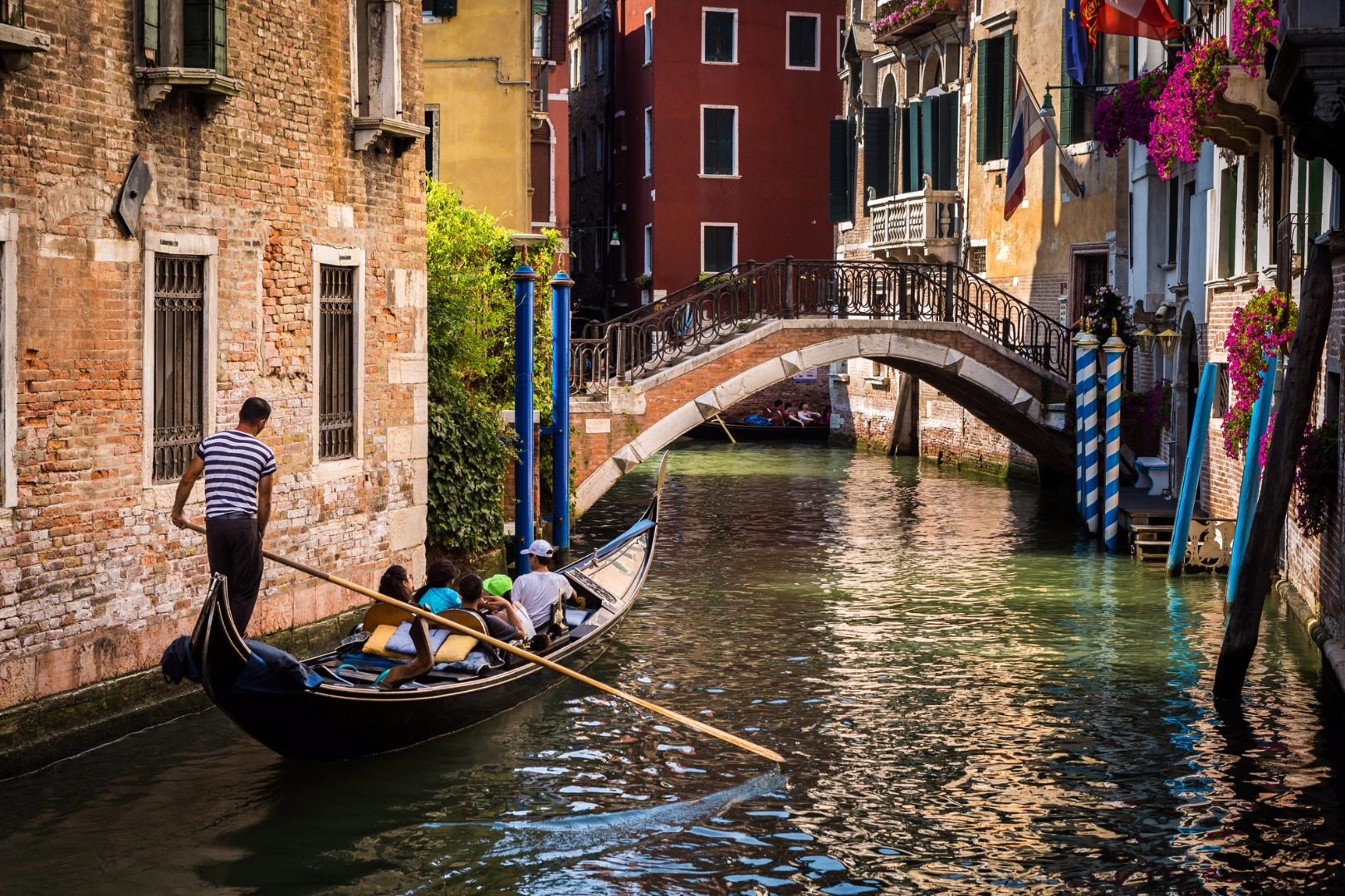 Italy Venice Gondola In The Canal With Bridge